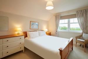 En eller flere senge i et værelse på Host & Stay - Amberleigh