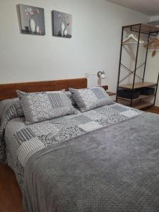 Postel nebo postele na pokoji v ubytování Turismo en Babia Bajo los nidos + 28 fotografií