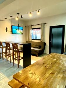 TV a/nebo společenská místnost v ubytování Riviera de Garopaba Unidade Vista Mar