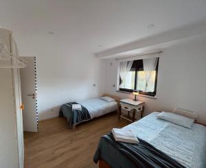 Postel nebo postele na pokoji v ubytování Casinha do Lago