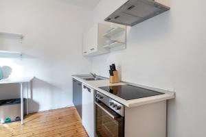 a kitchen with a sink and a counter top at Ferienwohnungen am Gellershagenpark 2 in Braksiek