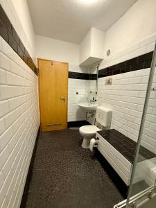 Koupelna v ubytování Pott Rooms & Flats