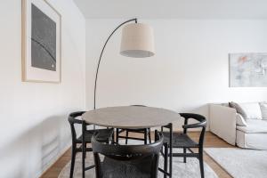 a dining room with a table and chairs at Bright & Cozy 1BR Home in Central Lahti in Lahti