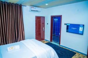 Ένα ή περισσότερα κρεβάτια σε δωμάτιο στο Spacious 4-Bedroom Apartment for families & groups