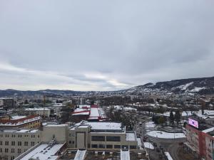 an aerial view of a city with snow covered buildings at San centar apartment in Banja Luka