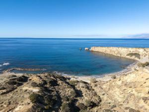 a view of the ocean from a cliff at Villa Theano in Triopetra