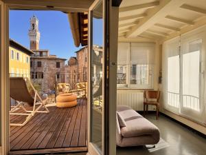 a balcony with a view of a building at LA COSTARELLA - Central with Cozy Terrace in Siena