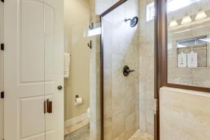 a bathroom with a shower with a glass door at Hot Tub and Fire Pit Modern Flagstaff Home in Flagstaff +26 photos