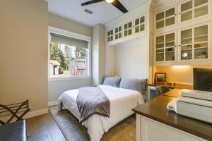 a bedroom with a bed and a desk and a window at Hot Tub and Fire Pit Modern Flagstaff Home in Flagstaff