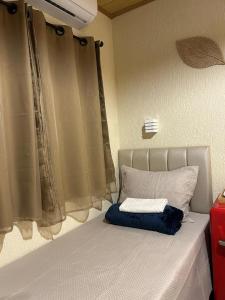 Ένα ή περισσότερα κρεβάτια σε δωμάτιο στο Suite Tarituba 4