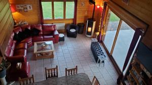 an overhead view of a living room with a couch at Grand Chalet in Bourbon-Lancy