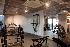 a gym with several exercise equipment in a room at Apartment with Mountain views Wex1 in Cape Town