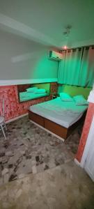 Postel nebo postele na pokoji v ubytování Hotel Centro Leste