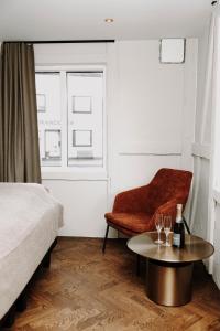 Postel nebo postele na pokoji v ubytování Bryggjan Boutique Hotel