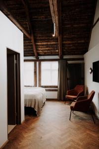 Postel nebo postele na pokoji v ubytování Bryggjan Boutique Hotel