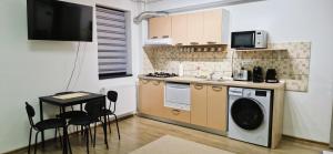 Kuchyň nebo kuchyňský kout v ubytování Apartament Atlas + 17 fotografií