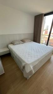 Ένα ή περισσότερα κρεβάτια σε δωμάτιο στο Monoambiente, capacidad 3 personas