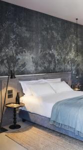 Ένα ή περισσότερα κρεβάτια σε δωμάτιο στο Antica Dimora Le Misure