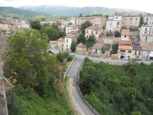 a view of a village with a road in the foreground at Casale di montagna in Cansano