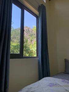 Ένα ή περισσότερα κρεβάτια σε δωμάτιο στο Nha Xanh Ninh Binh Homestay