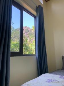 Ένα ή περισσότερα κρεβάτια σε δωμάτιο στο Nha Xanh Ninh Binh Homestay