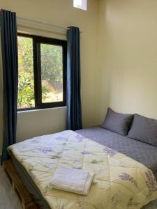 Ένα ή περισσότερα κρεβάτια σε δωμάτιο στο Nha Xanh Ninh Binh Homestay