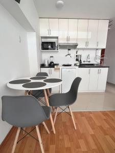 Nhà bếp/bếp nhỏ tại Qosqo Tampu Apart Hotel