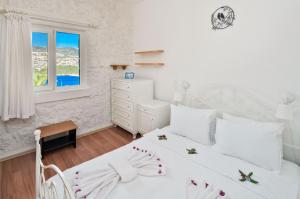 En eller flere senge i et værelse på TEKCE Club Patara N74