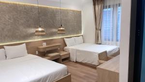 Postel nebo postele na pokoji v ubytování Nana Villa Hue