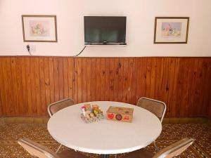 a white table with two boxes on top of it at Depto 1615 in Villa Mercedes