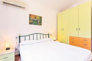 Ένα ή περισσότερα κρεβάτια σε δωμάτιο στο Casa Leomilda