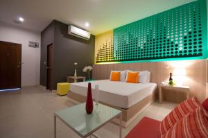 Ένα ή περισσότερα κρεβάτια σε δωμάτιο στο OK Resort Laemchabang