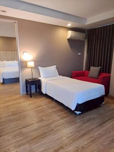 Postel nebo postele na pokoji v ubytování Baan Tanwa - MRT Ratchadapisek Exit 1 or 2