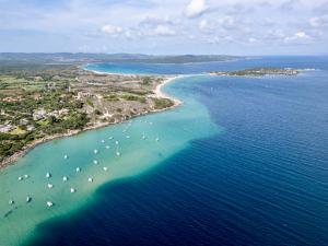 an aerial view of a beach with boats in the water at Residence with swimming pool in Costa Serena just 700 mt from the sea in Porto Rafael