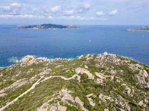 an aerial view of an island in the ocean at Residence with swimming pool in Costa Serena just 700 mt from the sea in Porto Rafael