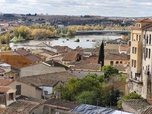 a view of a town with a river and buildings at SANTA EULALIA muy céntrico in Zamora