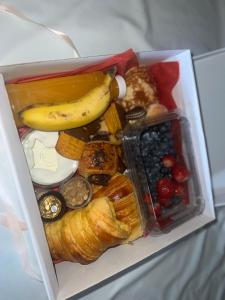 a lunch box filled with different types of food at Fonte Retreat Premium Suite in Sandim +42 photos