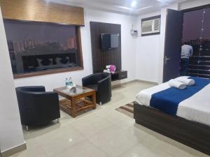 Voodi või voodid majutusasutuse Yashobhoomi Grand toas