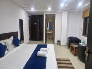 Voodi või voodid majutusasutuse Yashobhoomi Grand toas