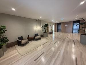 an empty lobby with chairs and a table in a building at 2BR at The Boulevard Nest Pool - Gym - Café Vibes in New cairo +291 photos