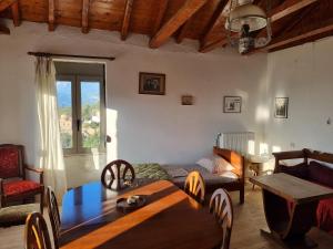 a living room with a table and a bed at Milionis Manor in Málta