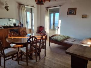 a living room with a table and a bed at Milionis Manor in Málta +20 photos