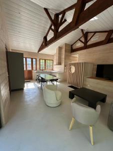 a large living room with a table and chairs at Le Refuge du Pyla in La Teste-de-Buch +24 photos