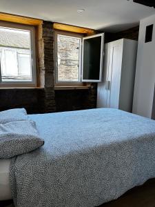 Postel nebo postele na pokoji v ubytování A Casiña da Ponte