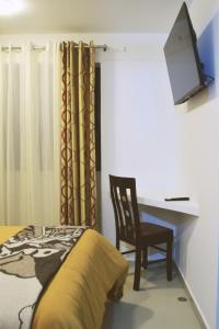 TV/trung tâm giải trí tại Qosqo Tampu Apart Hotel +29 ảnh