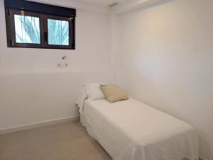 Postel nebo postele na pokoji v ubytování Modern apartment 2 minutes from Benicàssim beach