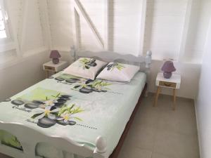 Ένα ή περισσότερα κρεβάτια σε δωμάτιο στο Villa Entre Ciel et Mer