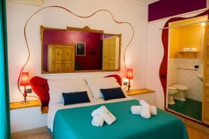 Ένα ή περισσότερα κρεβάτια σε δωμάτιο στο Hotiday Palermo Agostino