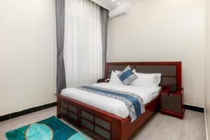 Postel nebo postele na pokoji v ubytování Beal Mall & Hotel