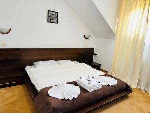 Postel nebo postele na pokoji v ubytování Vila Buget